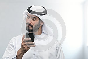 Arabian Businessman expressing disappointment on the phone