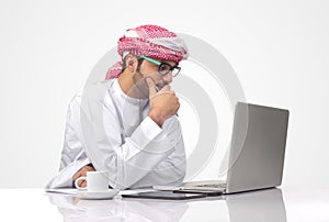 Arabian businessman working on his notebook