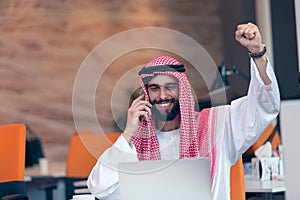 Arabian businessman working in modern startup office