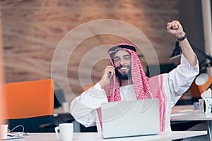 Arabian businessman working in modern startup office