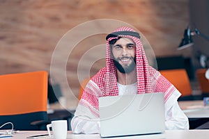 Arabian businessman working in modern startup office