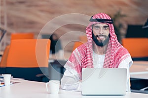 Arabian businessman working in modern startup office