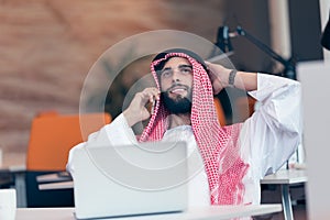 Arabian businessman working in modern startup office