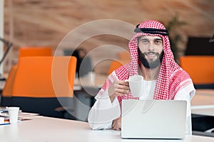 Arabian businessman working in modern startup office
