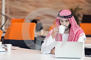 Arabian businessman working in modern startup office