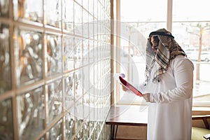 Arabian businessman working in office, business centre using devicesm gadgets. Lifestyle