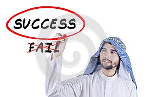 Arabian businessman writes success word