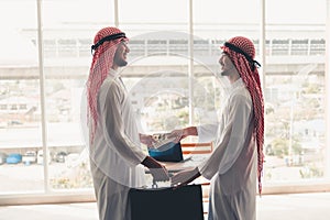 Arabian businessmen are handshake after successful dealing., Portrait of Arab businessman shaking hands to his business partner in