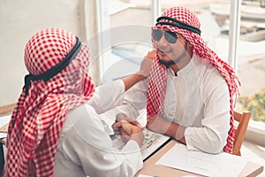 Arabian businessmen are handshake after successful dealing., Portrait of Arab businessman shaking hands to his business partner in