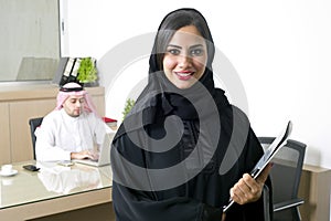 Arabian Businesswoman with her boss on Background