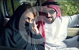 Arabian Couple in the car near home