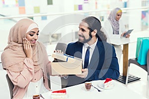 Arabian Couple Sitting in Cafe after Shopping.