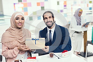 Arabian Couple Sitting in Cafe after Shopping.