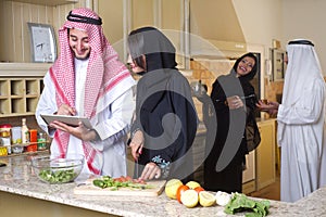 Arabian couples cooking & drinking coffee