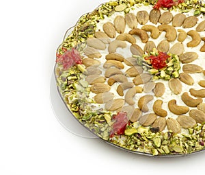 Arabian desserts of Qishta with pistachio, cashews and almonds