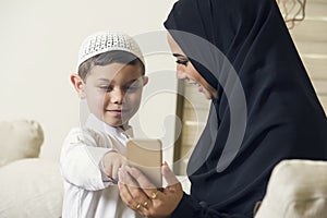 Arabian family, Arabian mother and son using mobile phone