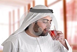 Arabian guy drinking tea / aroma tempting beverage