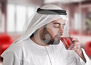 Arabian guy drinking tea / aroma tempting beverage