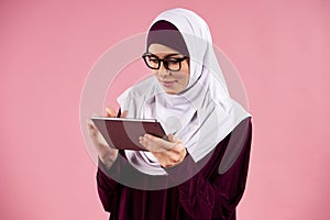 Arabian intelligent woman in hijab interacts