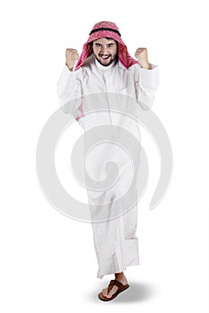 Arabian man celebrating his success in studio