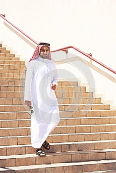 Arabian man going downstairs