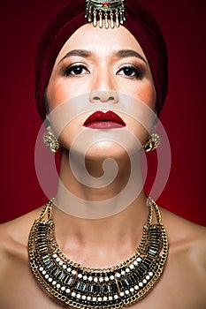 Arabian Middle East Muslim woman with strong color red lips