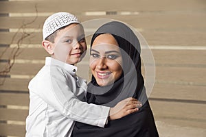 Arabian mother holding her son