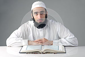 Arabian muslim man reading Quran