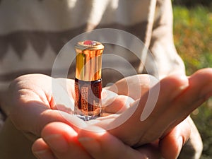 Arabian oud attar perfume or agarwood oil fragrances in mini bottle.