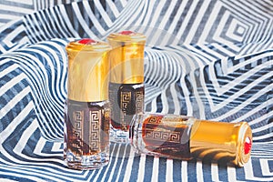 Arabian oud attar perfume or agarwood oil fragrances in mini bottles.