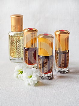 Arabian oud attar perfume or agarwood oil fragrances in mini bottles.