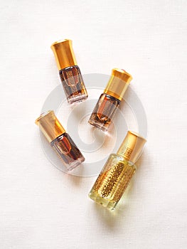 Arabian oud attar perfume or agarwood oil fragrances in mini bottles.