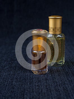 Arabian oud attar perfume or agarwood oil fragrances in mini bottles.