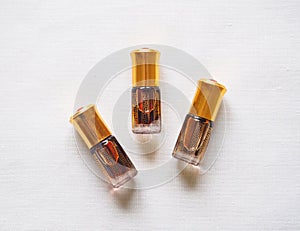 Arabian oud attar perfume or agarwood oil fragrances in mini bottles.