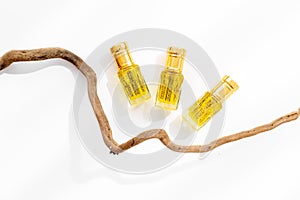 Arabian oud attar perfume essential oil in glass bottles, top view
