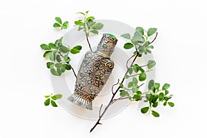 Arabian oud perfume or oil with agar wood tree. photo