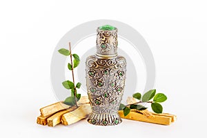 Arabian oud perfume or oil with agar wood tree. photo