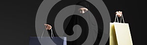 arabian woman in black niqab with