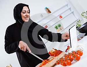 Arabian woman cooking in the kitchen