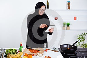 Arabian woman cooking in the kitchen