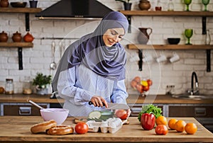Arabian woman cutting vegetables for her delicious meal