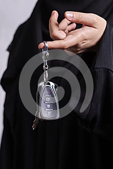 Arabian woman holding car keys
