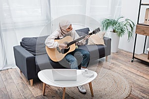 arabian woman playing guitar during video