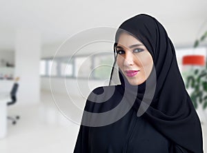 Arabian woman posing in a business center