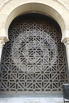 Arabic arch encloses acarved jali screen