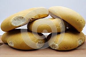 Arabic bread isolated over wooden table and white background