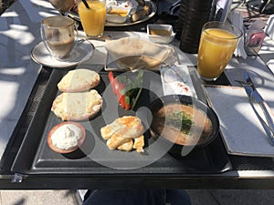 Arabic breakfast served on an outdoor restaurant terrace in Doha, Qatar