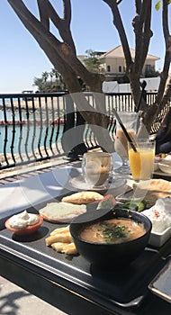 Arabic breakfast served on an outdoor restaurant terrace in Doha, Qatar