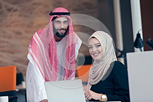 Arabic business couple working together on project at modern startup office