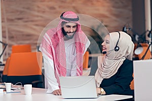 Arabic business couple working together on project at modern startup office